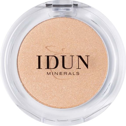 A round compact with beige mineral powder labeled 'IDUN MINERALS'. Clear plastic case with lid, showing powder inside.