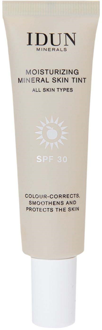 IDUN Minerals moisturizing mineral skin tint in a white tube with SPF 30, for all skin types, protecting and smoothing skin.