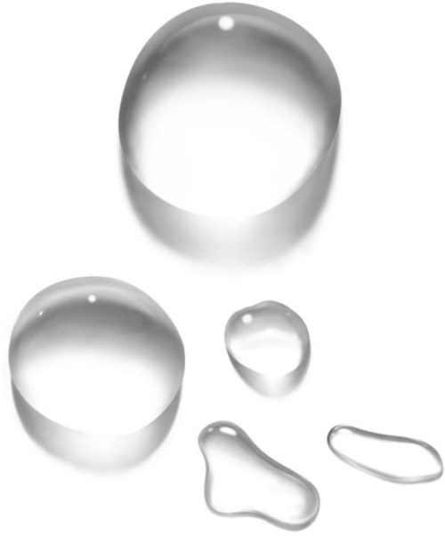 Clear glass drops and blobs of different sizes on a white background.