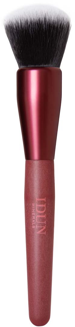 A makeup brush with a pink handle, black and white bristles, used for applying makeup.
