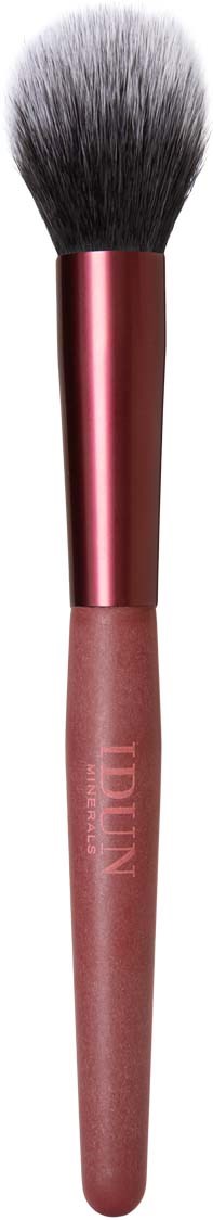 A makeup brush with a pink handle and black fluffy bristles on a black background.