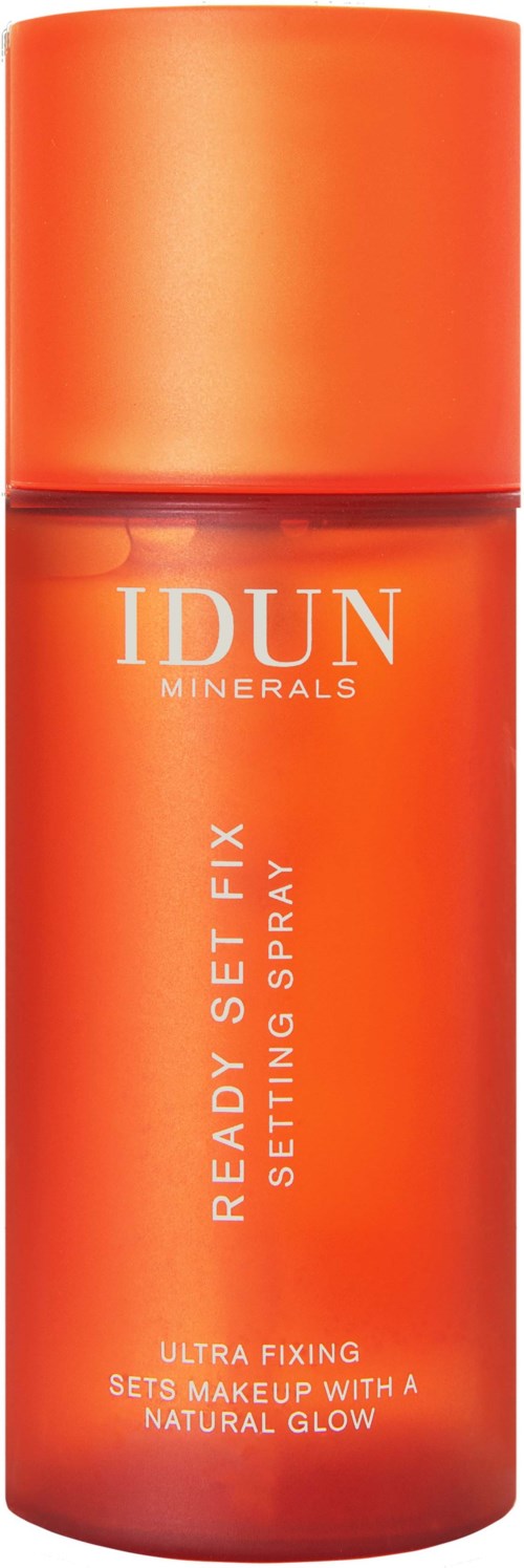 Orange spray bottle labeled IDUN Minerals Ready Set Fix for setting makeup with a natural glow.