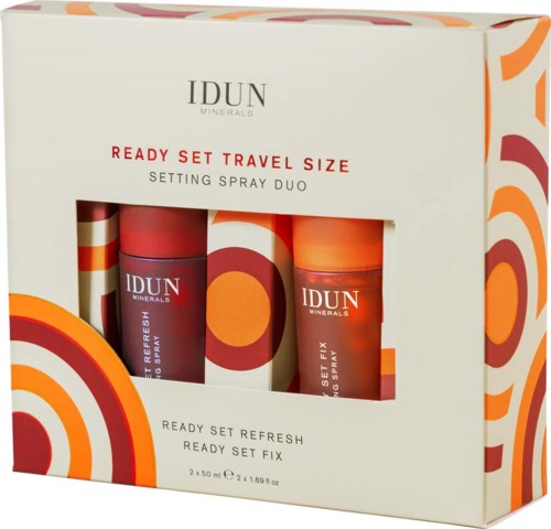A travel set with two spray bottles, colorful design, and clear product labels in a box.