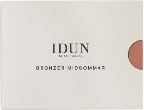 Eine weiße Box mit schwarzem Text sagt IDUN MINERALS BRONZER MIDSUMMAR, mit einem runden rosafarbenen Bronzer auf der Seite.