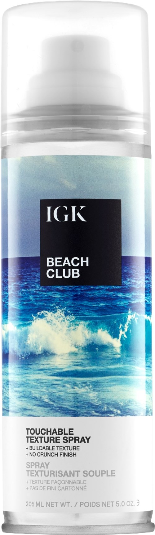Eine Sprühflasche mit dem Label IGK Beach Club und Wellenmuster.
