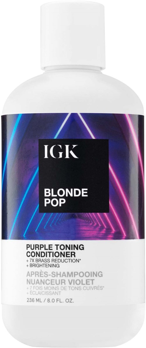 En hvit flaske med blondekondisjonør med lilla og blå neonlys på etiketten.