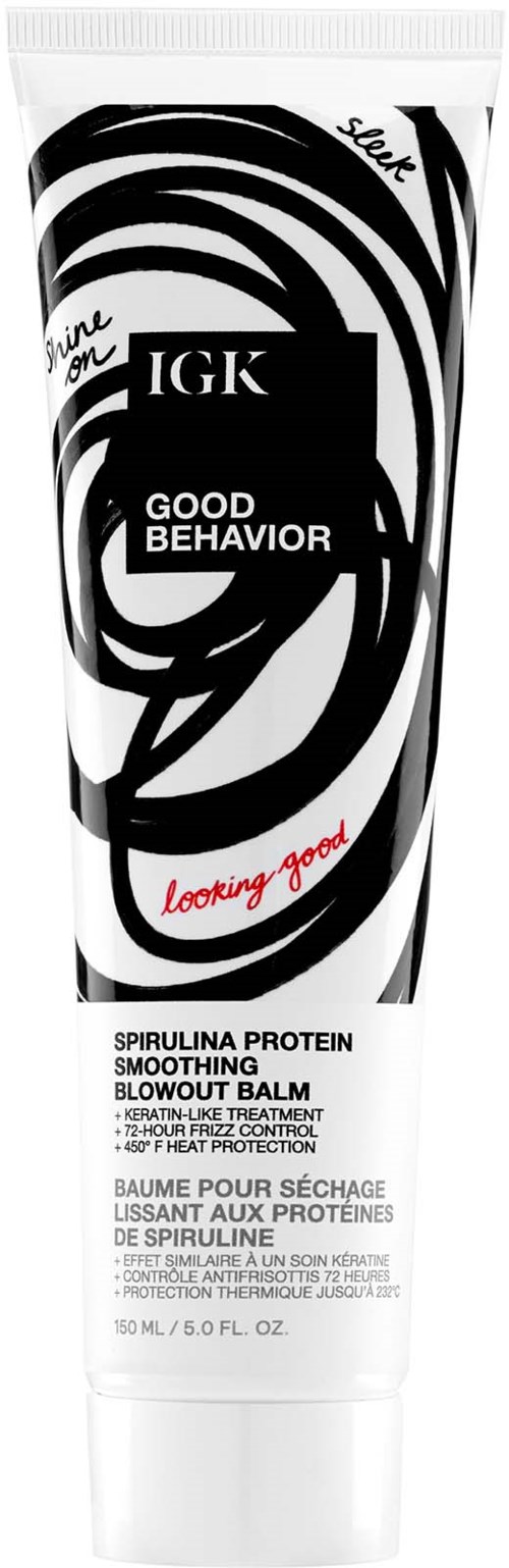 Eine Tube IGK Good Behavior Glättungs-Balm mit Schwarz-Weiß-Galaxie-Design und rotem Text.