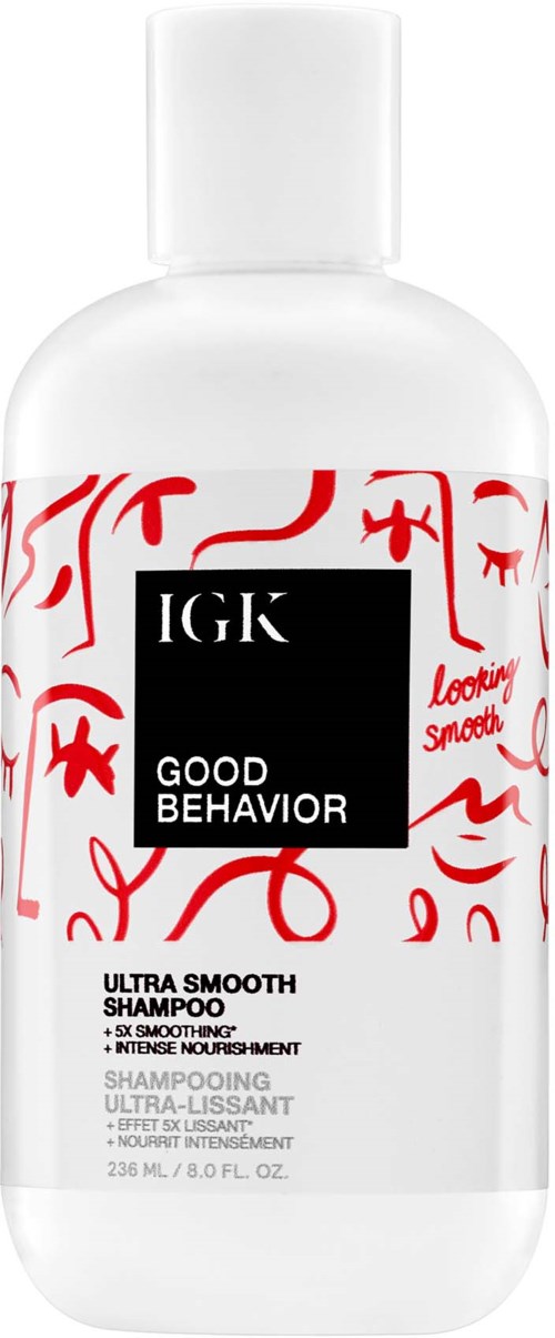 Een witte fles van IGK Good Behavior shampoo met rood en zwart ontwerp, 236 ml, zijndefiniërend en voedend.