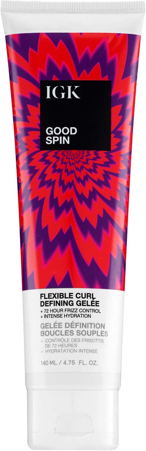 En tube med IGK Good Spin gel med et fargerikt, virvlende, rødt og lilla design, merket som fleksibel krølltopp.