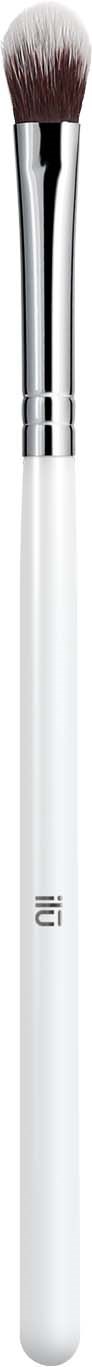 A white makeup brush with soft bristles and a shiny metal handle. The brush is vertical against a black background.