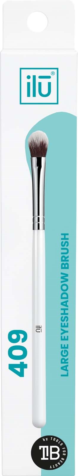 A large eye shadow brush in white handle packaging with a teal and white label. Text includes 'ilū', '409', and 'LARGE EYE SHADOW BRUSH.'