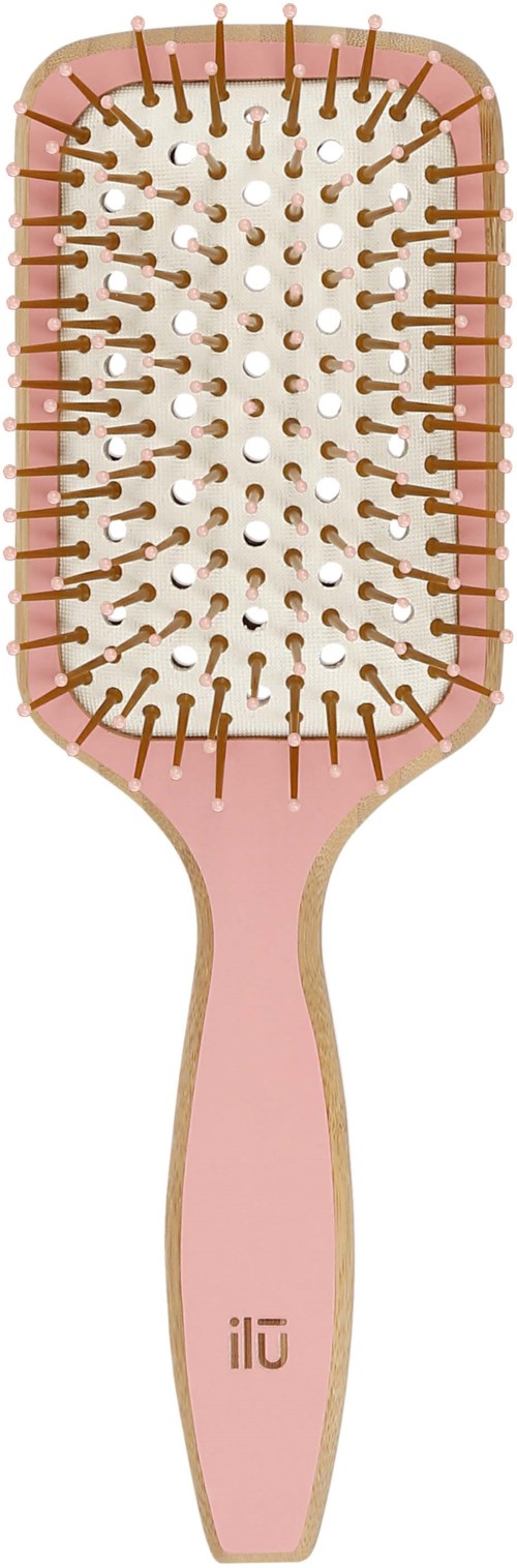 A pink hairbrush with many bristles and small holes inside. The handle has a brand name 'ilu' on it.