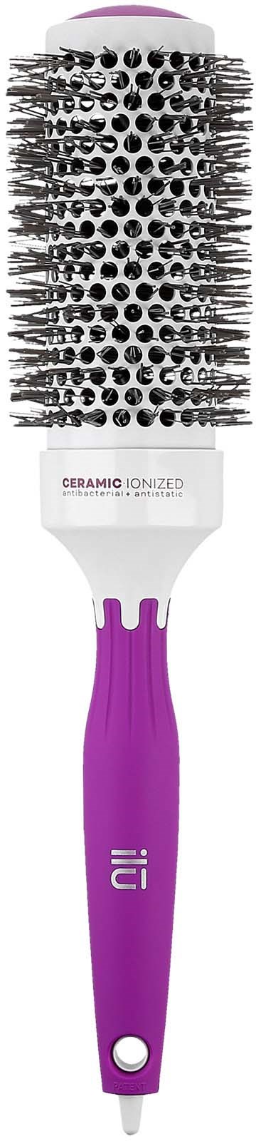 A round hairbrush with purple handle and black and white bristles.