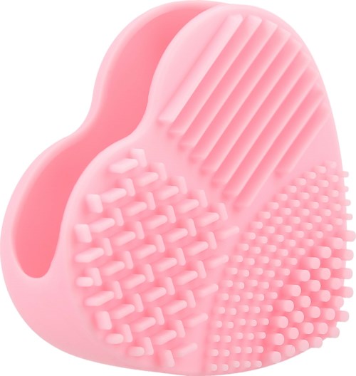 A pink silicone facial cleansing brush with four different textured sides for cleaning and exfoliating skin.