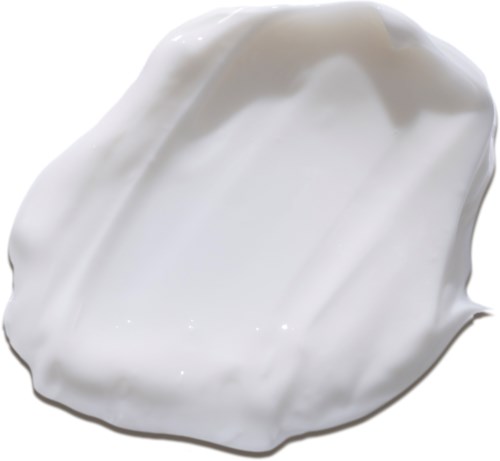 Een witte, romige substantie met een gladde textuur en glanzend oppervlak, mogelijk een lotion of zeep.