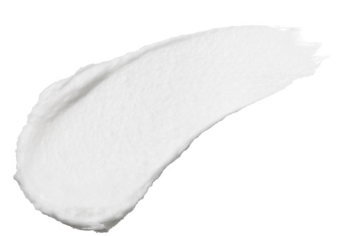 A white cream or lotion smeared in an irregular shape on a black background.