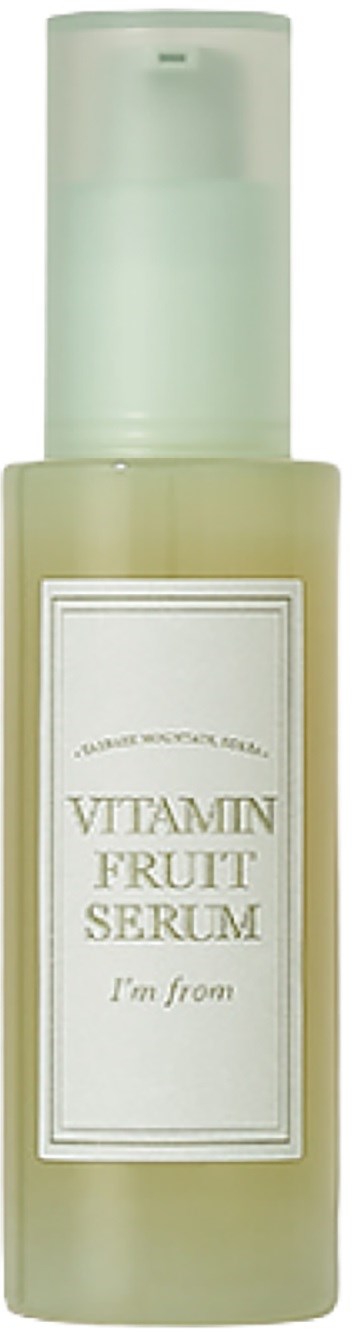Een flesje vitaminefruitserum met pomp en wit etiket. Het etiket zegt "VITAMIN FRUIT SERUM".