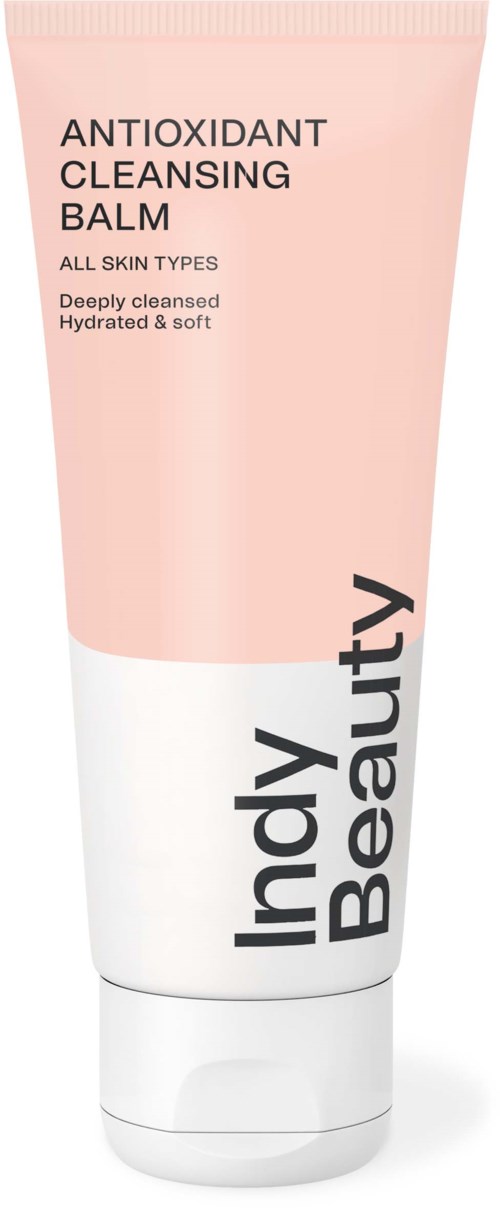 A skincare tube labeled 'Antioxidant Cleansing Balm' by Indy Beauty, designed for all skin types, pink and white packaging.