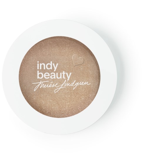 En runt behållare med beige pulver och orden: 'indy beauty' och 'thúres yndgren' i vitt.