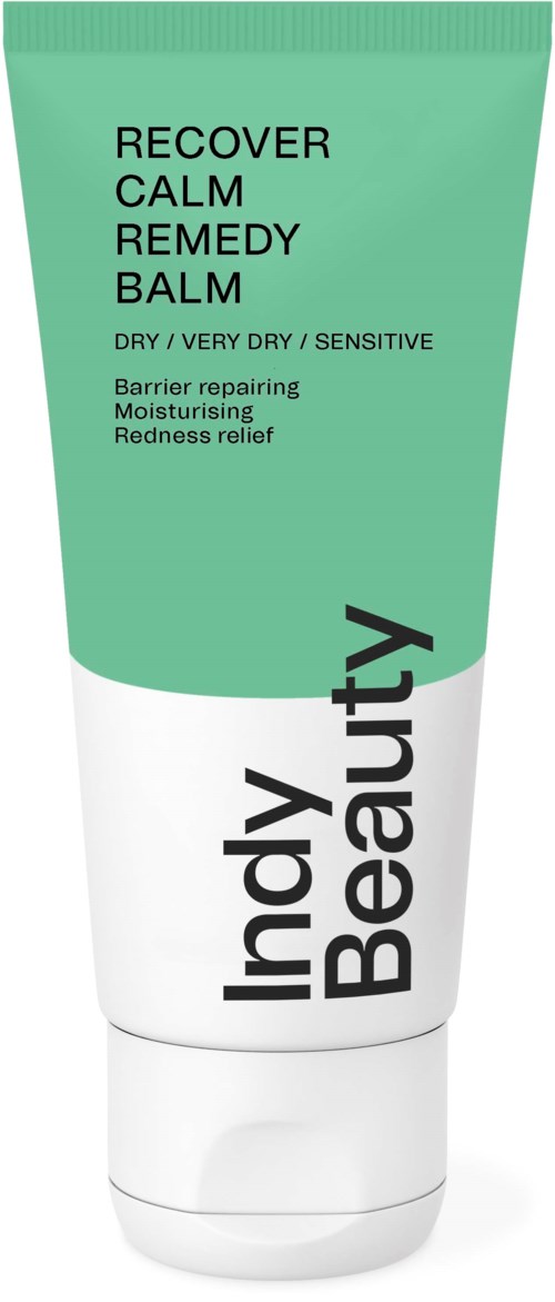 A green and white tube labeled "Indy Beauty Recover Calm Remedy Balm" for very dry skin with healing ingredients.