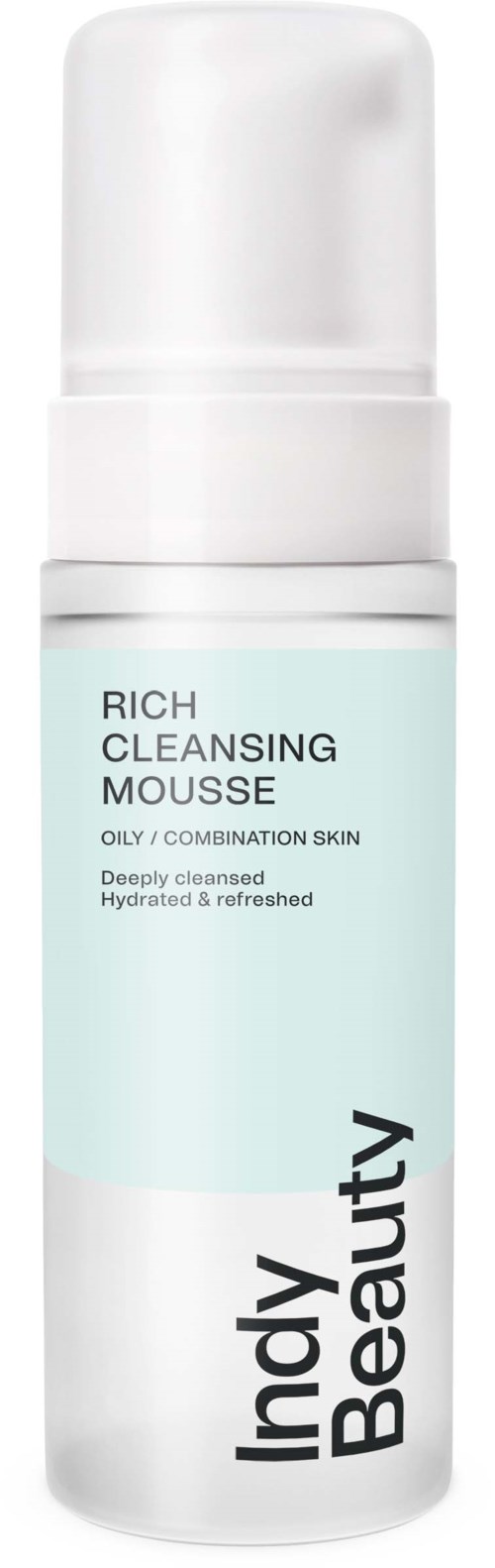 A white and light blue bottle labeled 'Indy Beauty' with a pump, containing rich cleansing mousse for oily skin.