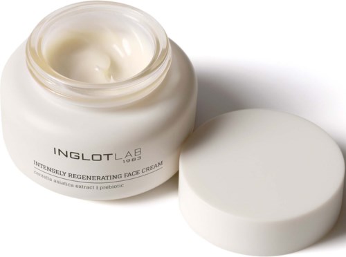 Open jar of Inglot Lab face cream, creamy white finish, with lid beside it. Contains ingredients like centella and probiotics.