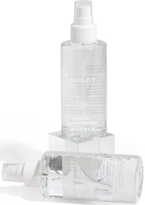 Two clear bottles, one standing and one lying down, with spray caps, containing skincare liquid.