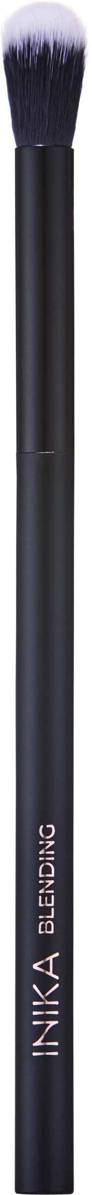 A black makeup brush with white bristles. It has a sleek handle with the brand name INIKA ELIMIN8 printed on it.