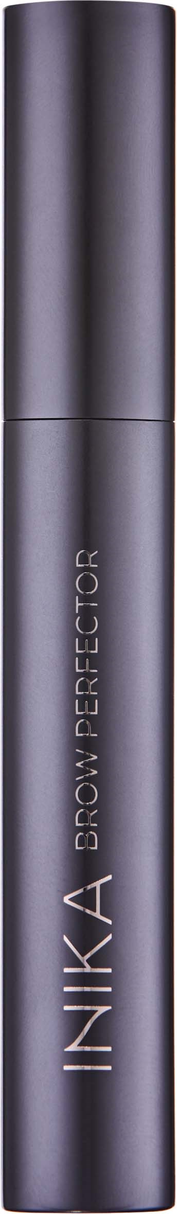 A dark grey cylindrical container labeled "INIKA CONCEALER" against a black background.