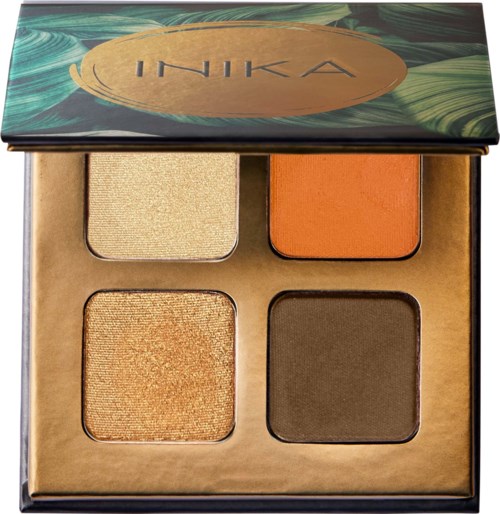 A makeup palette with four eyeshadows in shades of beige, orange, gold, and dark brown.