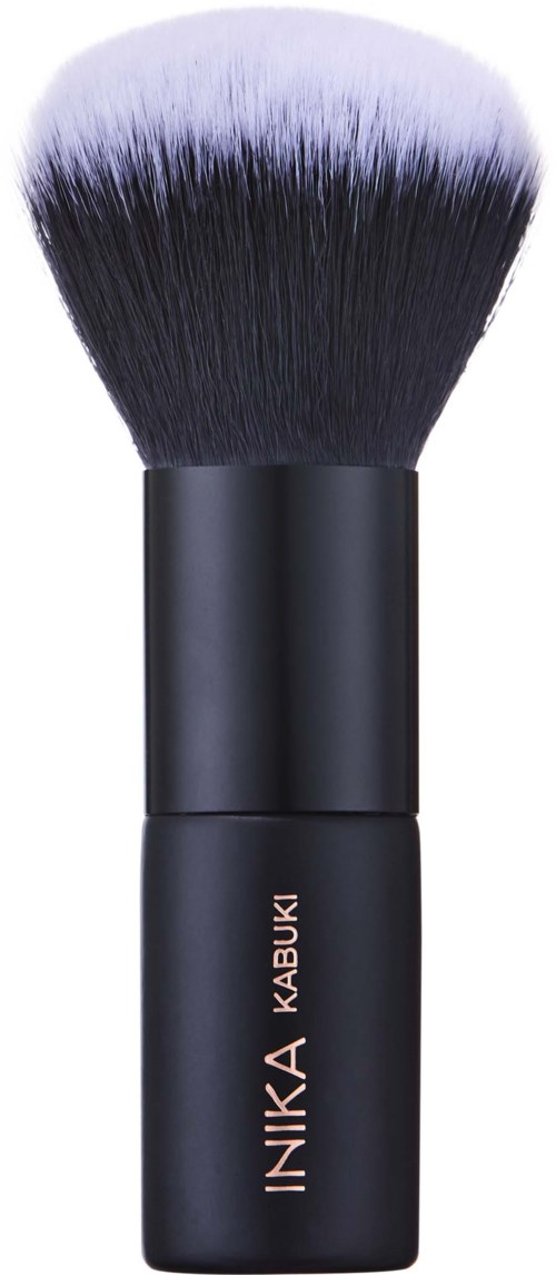 A makeup brush with black handle and soft, fluffy bristles with purple tips.