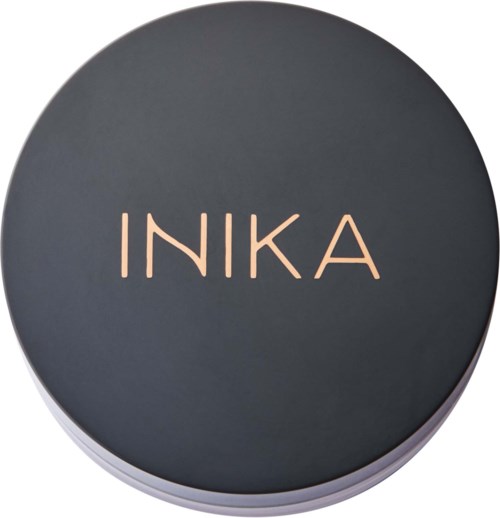 Round container with a dark lid and the word INIKA in pink letters.