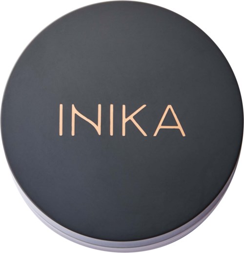 A round container with a dark cover that has the word 'INKA' written on it in light-colored letters.