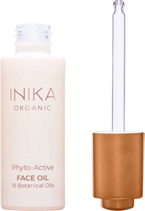 Valkoinen pullo, jossa lukee 'INIKA ORGANIC Phyto-Active FACE OIL', ja korkki sekä tippojatka.