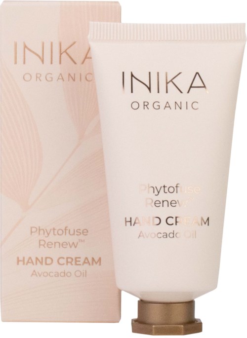 En vit handkrämstub bredvid en rosa låda, båda märkta 'INKA ORGANIC Phytofuse Renew' med avokadoolja.