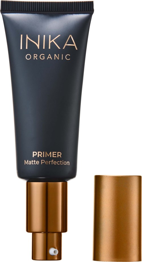 Mustan värinen Nika Organic Primer -putki, jonka kullansävyinen korkki ja merkintä 'Matte Perfection.' Korkki on erilläänputkesta.