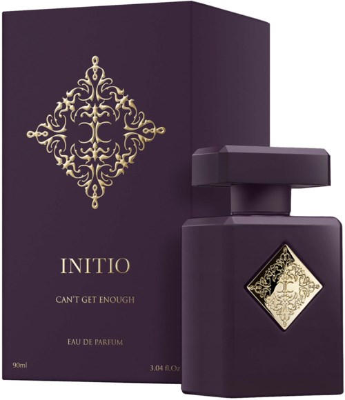 Dunkellila Parfümverpackung und Flasche mit goldener Dekoration und Label, mit ‚INITIO CAN'T GET ENOUGH‘.