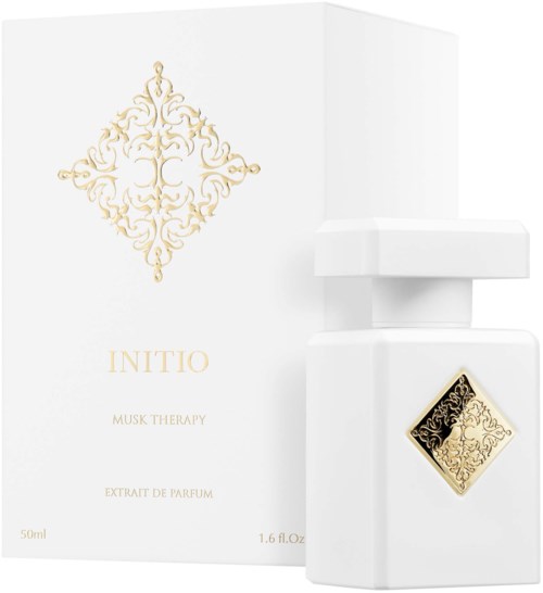 Eine weiße Parfümflasche mit Goldverzierungen und eine Schachtel mit goldem Muster und dem Wort INITIO.