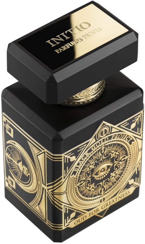 Eine schwarze und goldene Flasche mit detaillierten Mustern, goldenem Deckel und Beschriftung.