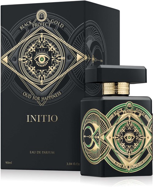 Ein Parfüfflasche und eine Schachtel mit goldener und grüner Augen und auffälligem Design, Beschriftung 'INITIO' und 'Oud for Happiness.'