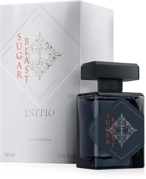 A perfume bottle and box with decorative design and red text that reads Sugar Blast, in elegant style.