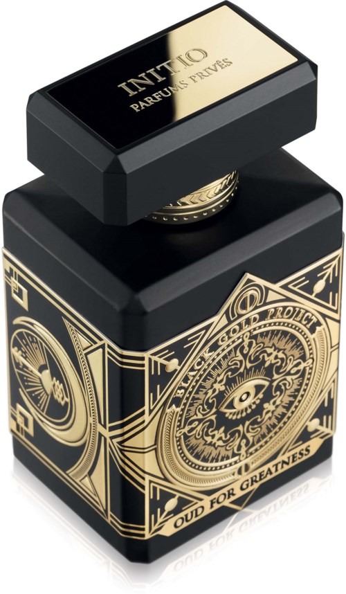 Eine schwarze Tintenflasche mit goldenen Mustern und der Aufschrift "OUD FOR GREATNESS".