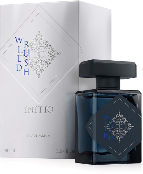 A perfume bottle with a dark blue color next to a white box, both have a decorative logo and text.
