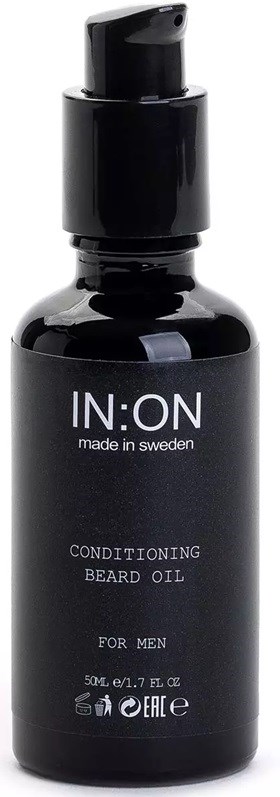 A black bottle with a pump sits upright. It is labeled conditioning beard oil for men, made in Sweden.