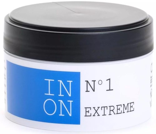 A white container with a black lid, featuring a blue label with white and black text, states IN ON and extreme.