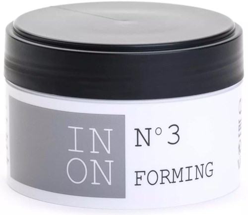 A container with a black lid and a white label. The label has text about a forming product, mentioning IN ON and N 3.