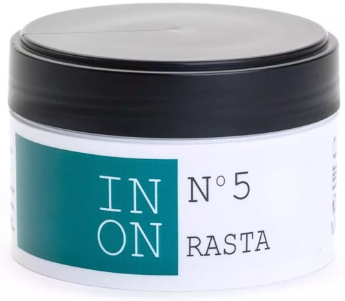 A white container with a silver lid labeled IN ON No 5 Rasta, likely a cosmetic or hair product.