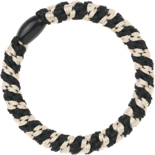 A black and white striped fabric hair tie with a black plastic end piece. It forms a circle.
