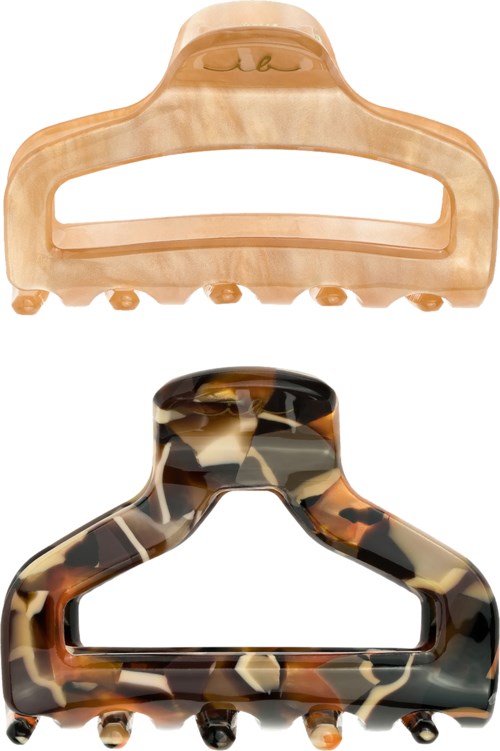 Two hair clips, one beige and one tortoiseshell pattern, with curved shapes and small balls at the bottom.