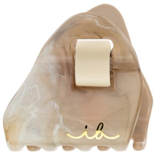 A cream-colored nail polish bottle with a marbled design and a gold signature logo on it.